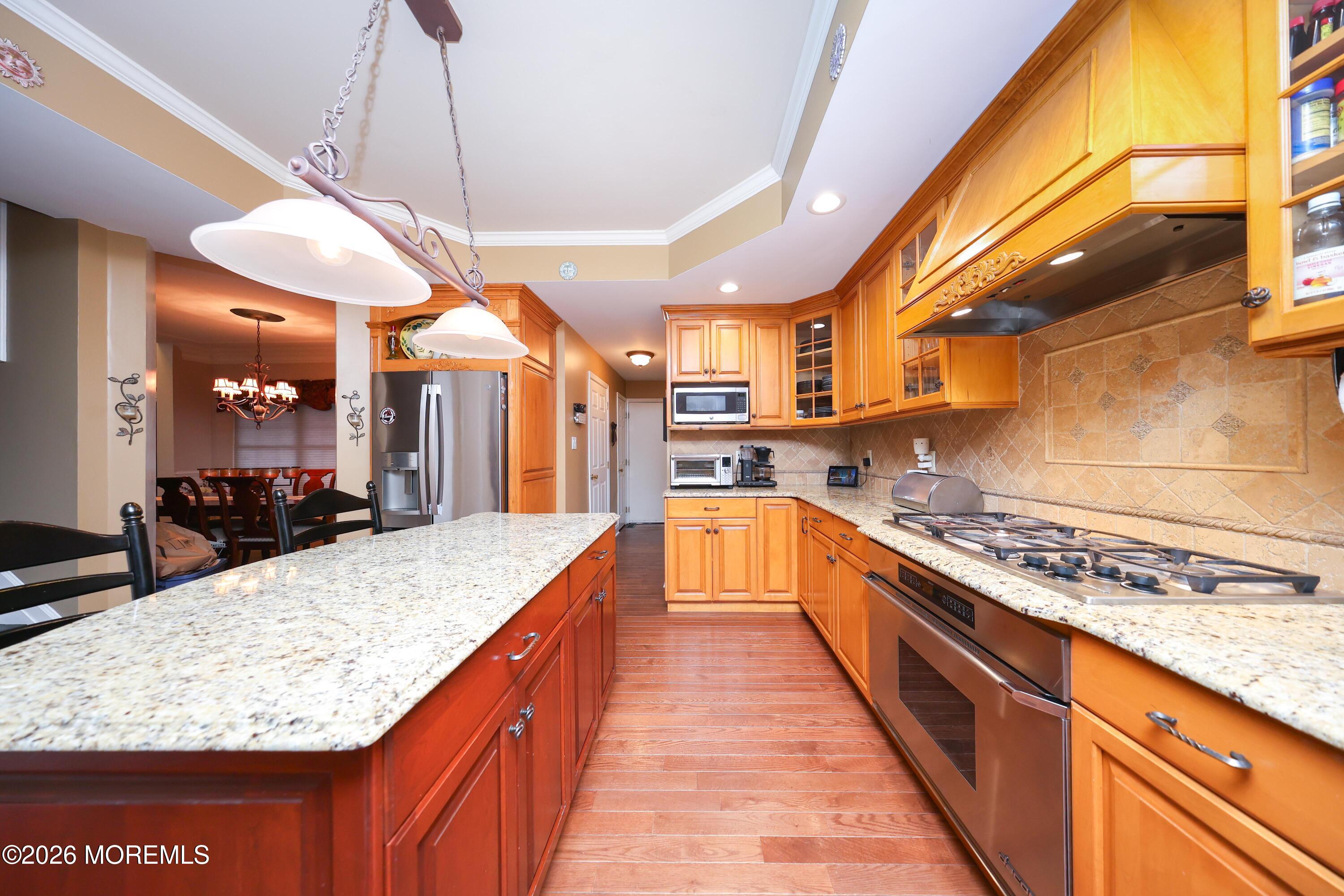 8 Clearbrook Court Howell, NJ 07731 - Photo 17 of 62 a large kitchen with stainless steel appliances granite countertop wooden cabinets a oven and a counter top