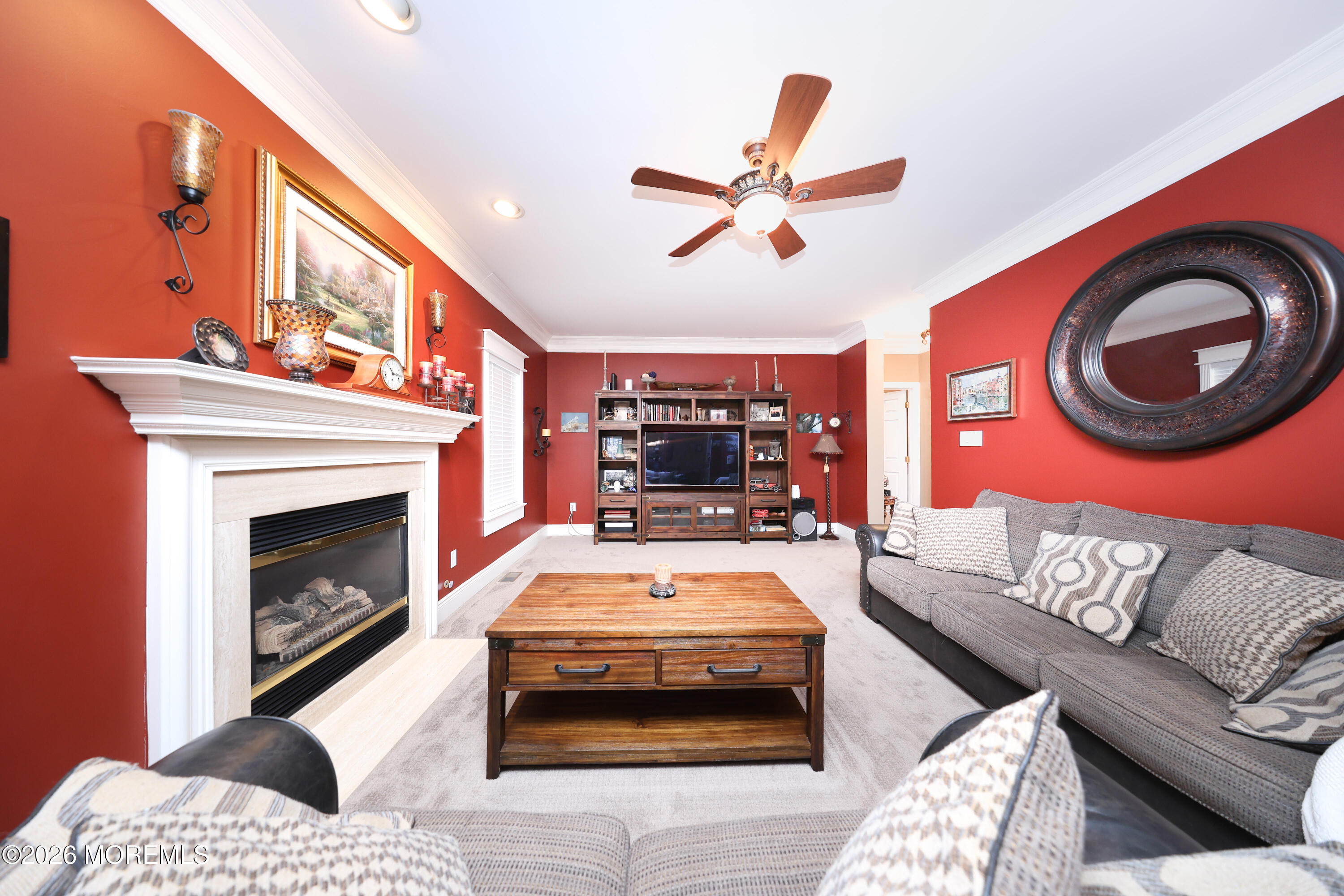 8 Clearbrook Court Howell, NJ 07731 - Photo 23 of 62 a living room with a couch and a fireplace