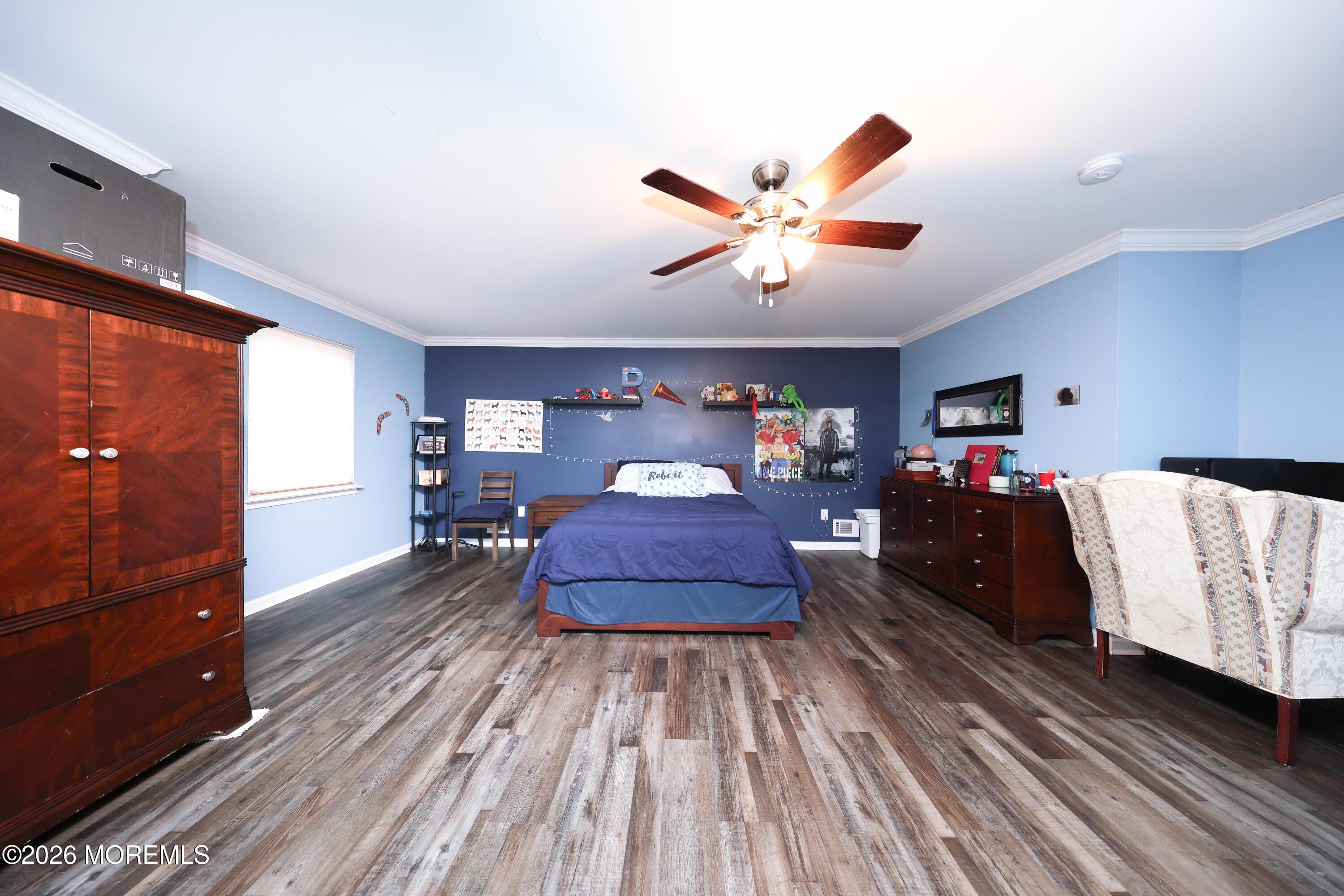 8 Clearbrook Court Howell, NJ 07731 - Photo 34 of 62 a bed room with a bed and a chandelier