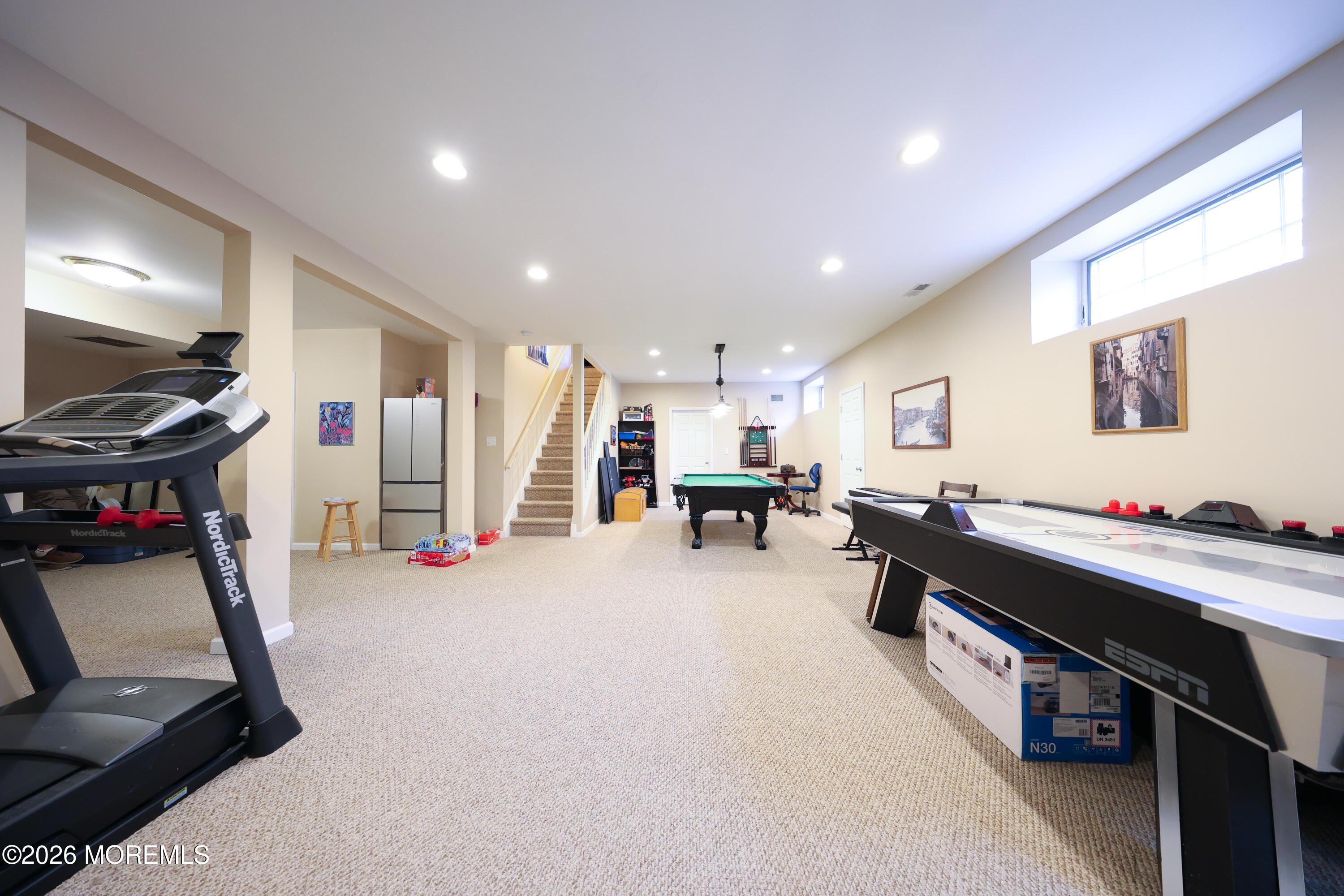 8 Clearbrook Court Howell, NJ 07731 - Photo 42 of 62 a room with furniture and a flat screen tv