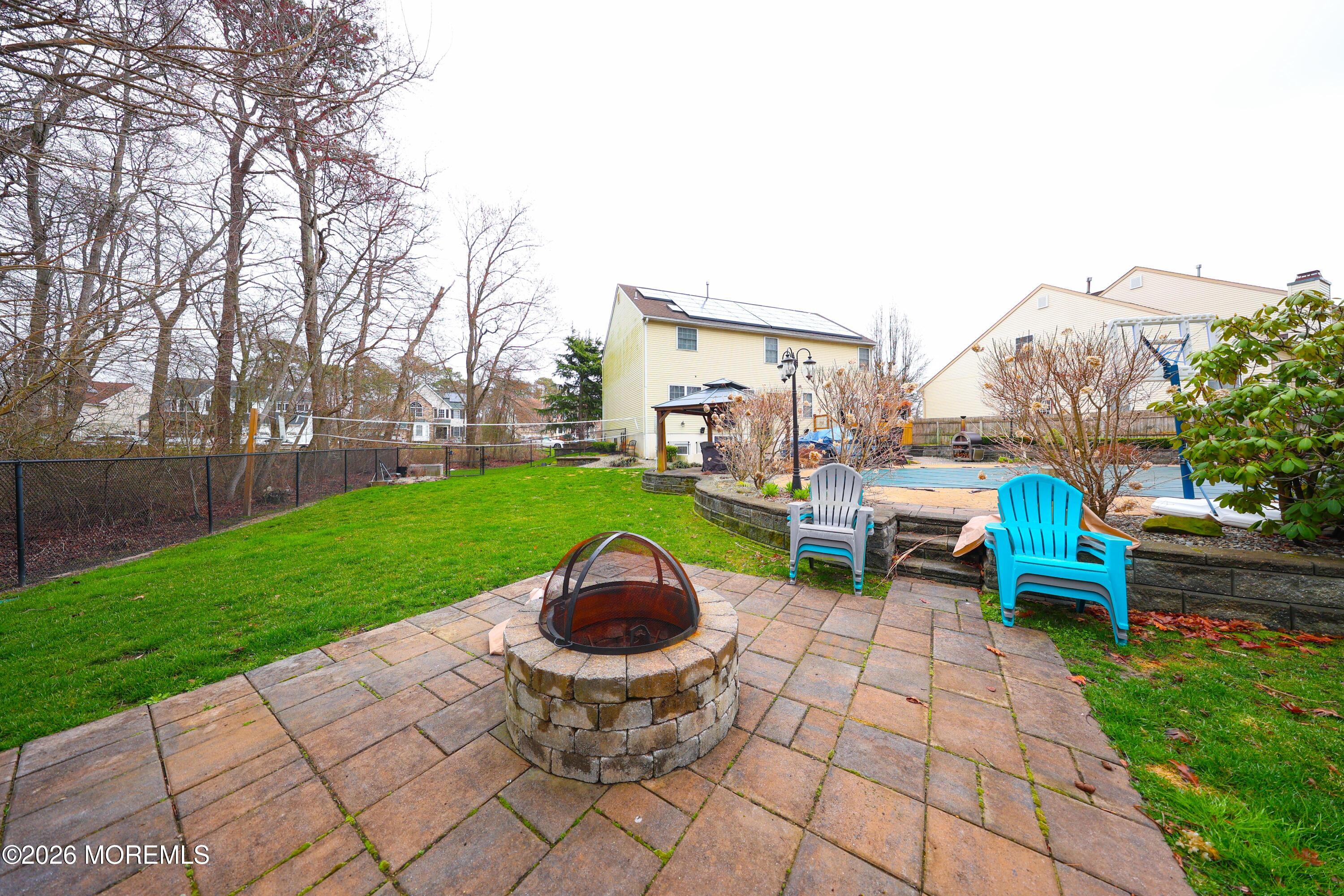 8 Clearbrook Court Howell, NJ 07731 - Photo 50 of 62 a view of a backyard with sitting area