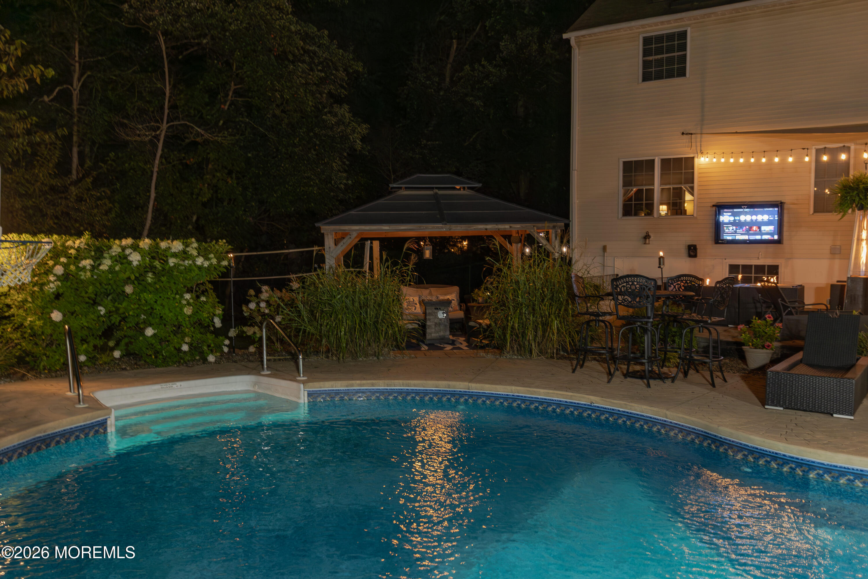 8 Clearbrook Court Howell, NJ 07731 - Photo 55 of 62 a patio with table and chairs and potted plants