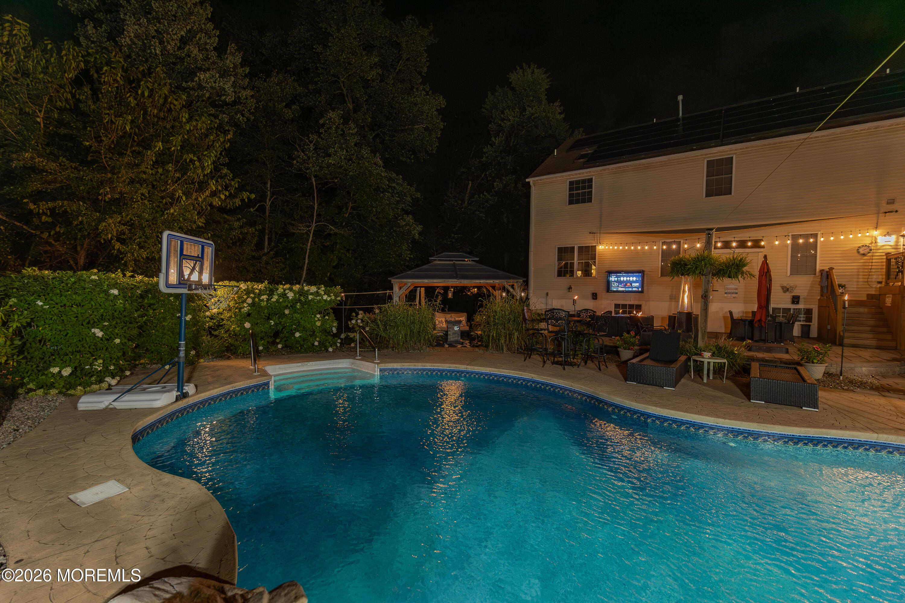 8 Clearbrook Court Howell, NJ 07731 - Photo 56 of 62 a swimming pool with outdoor seating and yard