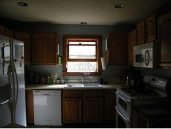 349 Deerfield Road, Unit R337 Allenstown, NH 03275 - Photo 2 of 10 a kitchen with a sink stove and microwave