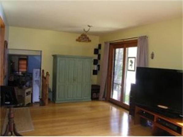 349 Deerfield Road, Unit R337 Allenstown, NH 03275 - Photo 4 of 10 a view of a room with wooden floor and windows