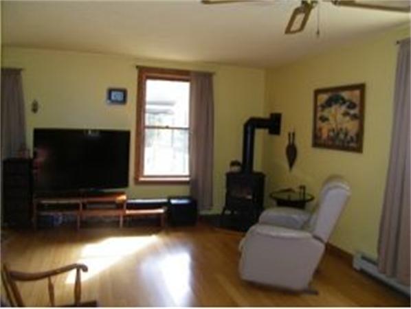 349 Deerfield Road, Unit R337 Allenstown, NH 03275 - Photo 5 of 10 a living room with furniture and a flat screen tv