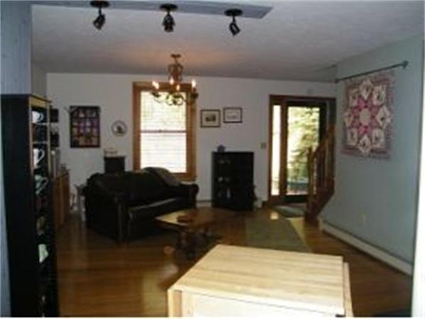 349 Deerfield Road, Unit R337 Allenstown, NH 03275 - Photo 6 of 10 a living room with furniture windows and a fireplace