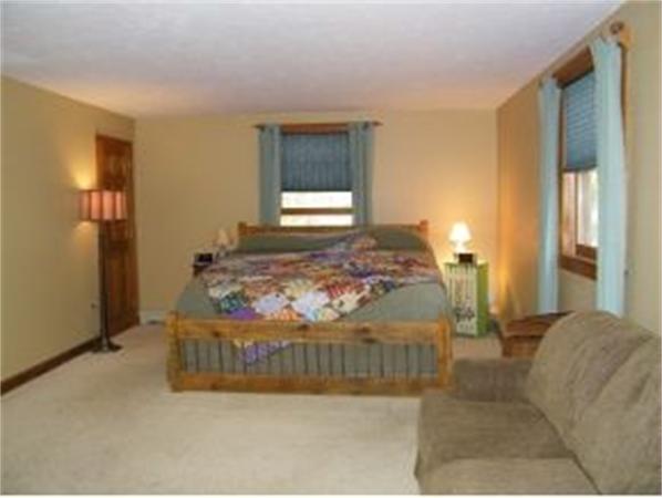 349 Deerfield Road, Unit R337 Allenstown, NH 03275 - Photo 8 of 10 a bedroom with a bed and window
