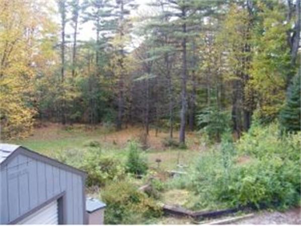 349 Deerfield Road, Unit R337 Allenstown, NH 03275 - Photo 9 of 10 a backyard of a house with lots of green space