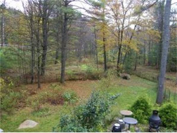 349 Deerfield Road, Unit R337 Allenstown, NH 03275 - Photo 10 of 10 a view of a forest with trees in the background