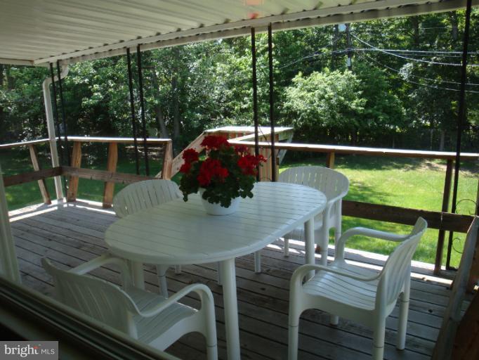 1900 Harewood Road Edgewood, MD 21040 - Photo 1 of 29 a view of a balcony with table and chairs