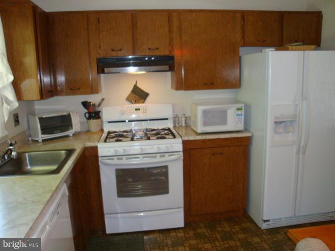 1900 Harewood Road Edgewood, MD 21040 - Photo 3 of 29 a stove top oven sitting inside of a kitchen