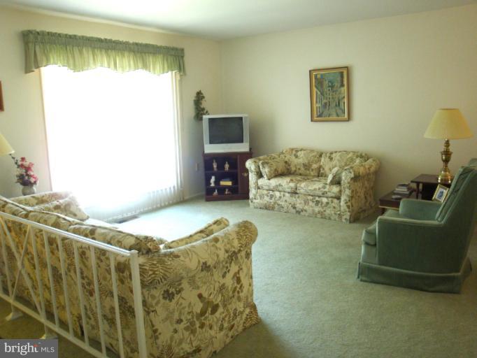 1900 Harewood Road Edgewood, MD 21040 - Photo 6 of 29 a living room with furniture and a flat screen tv