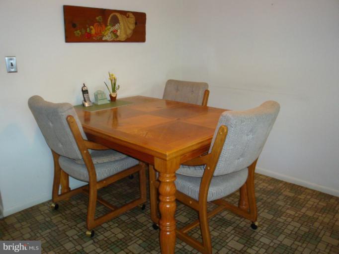 1900 Harewood Road Edgewood, MD 21040 - Photo 7 of 29 a dining room with furniture and wooden floor
