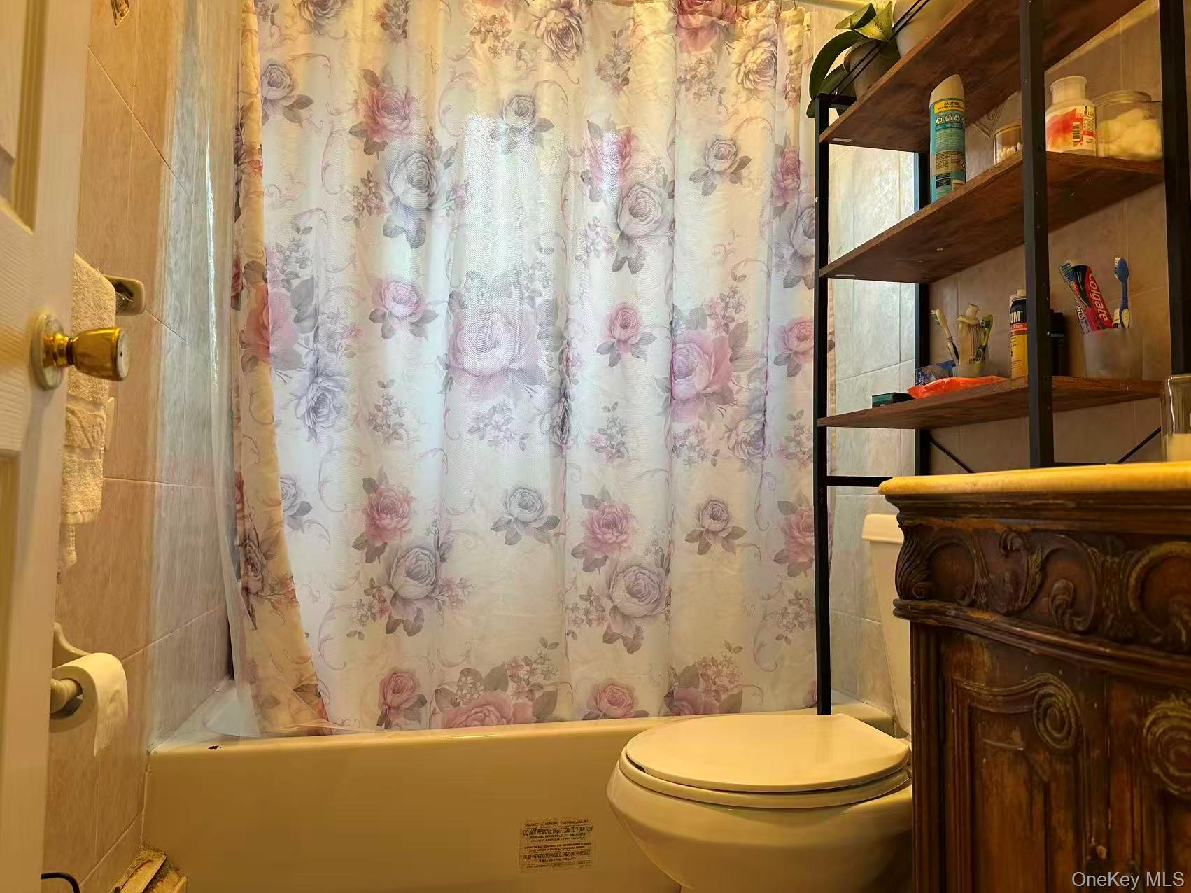 80-29 57th Street Queens, NY 11385 - Photo 3 of 12 Full bath with shower / tub combo and vanity