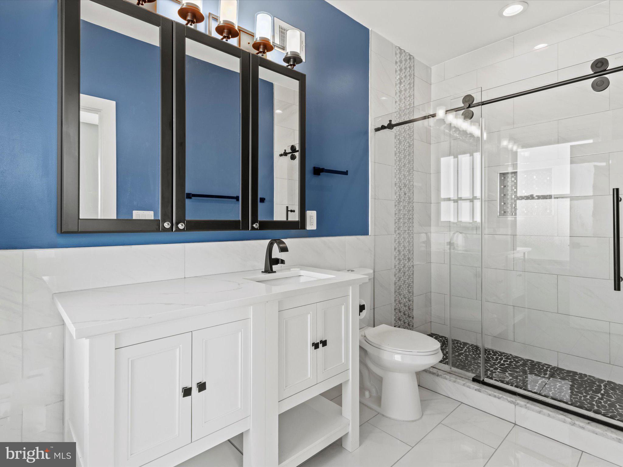 1267 Penn Street Northeast, Unit B Washington, DC 20002 - Photo 12 of 20 a bathroom with a toilet sink and shower
