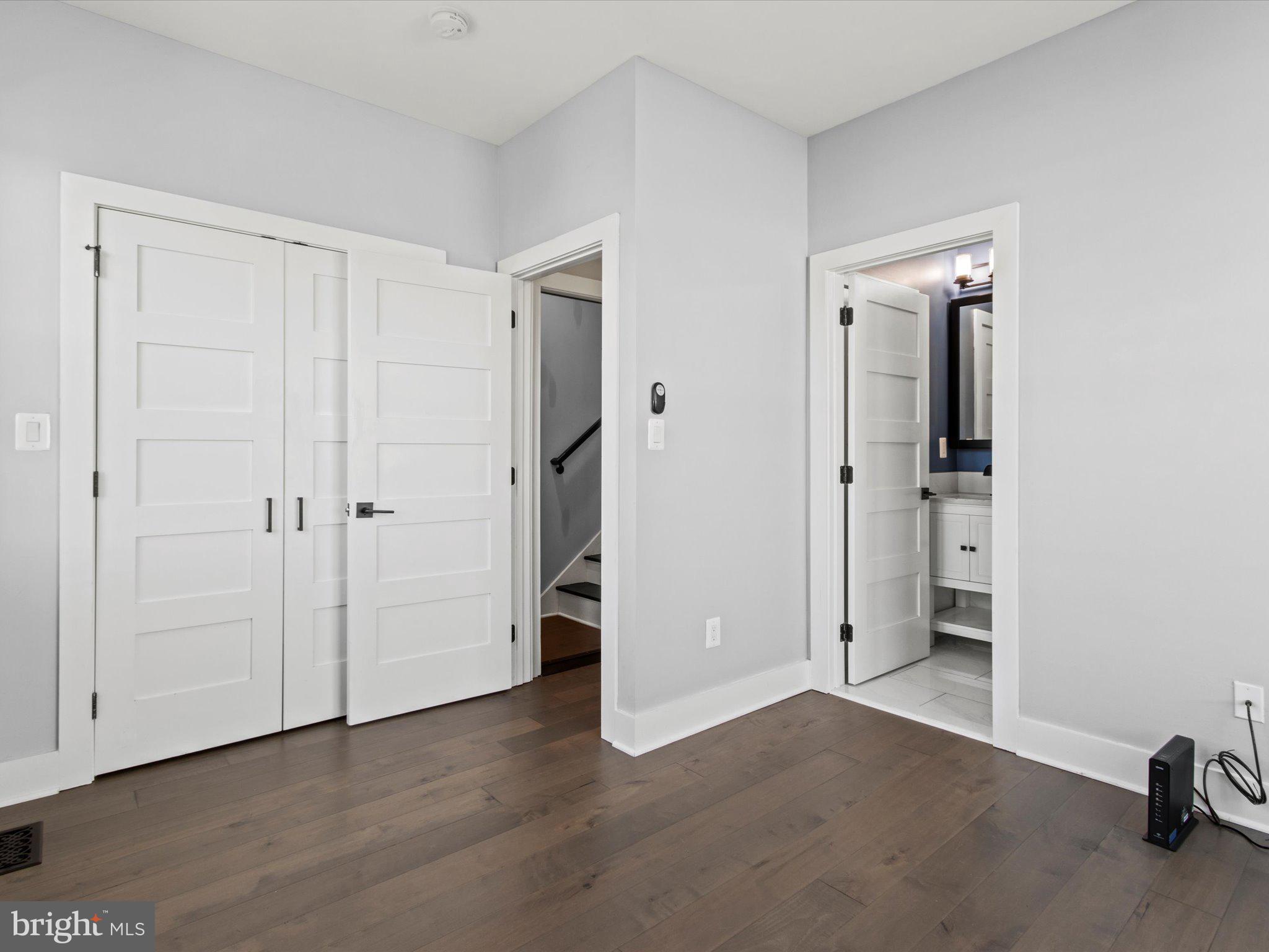 1267 Penn Street Northeast, Unit B Washington, DC 20002 - Photo 13 of 20 wooden floor and closet in a room