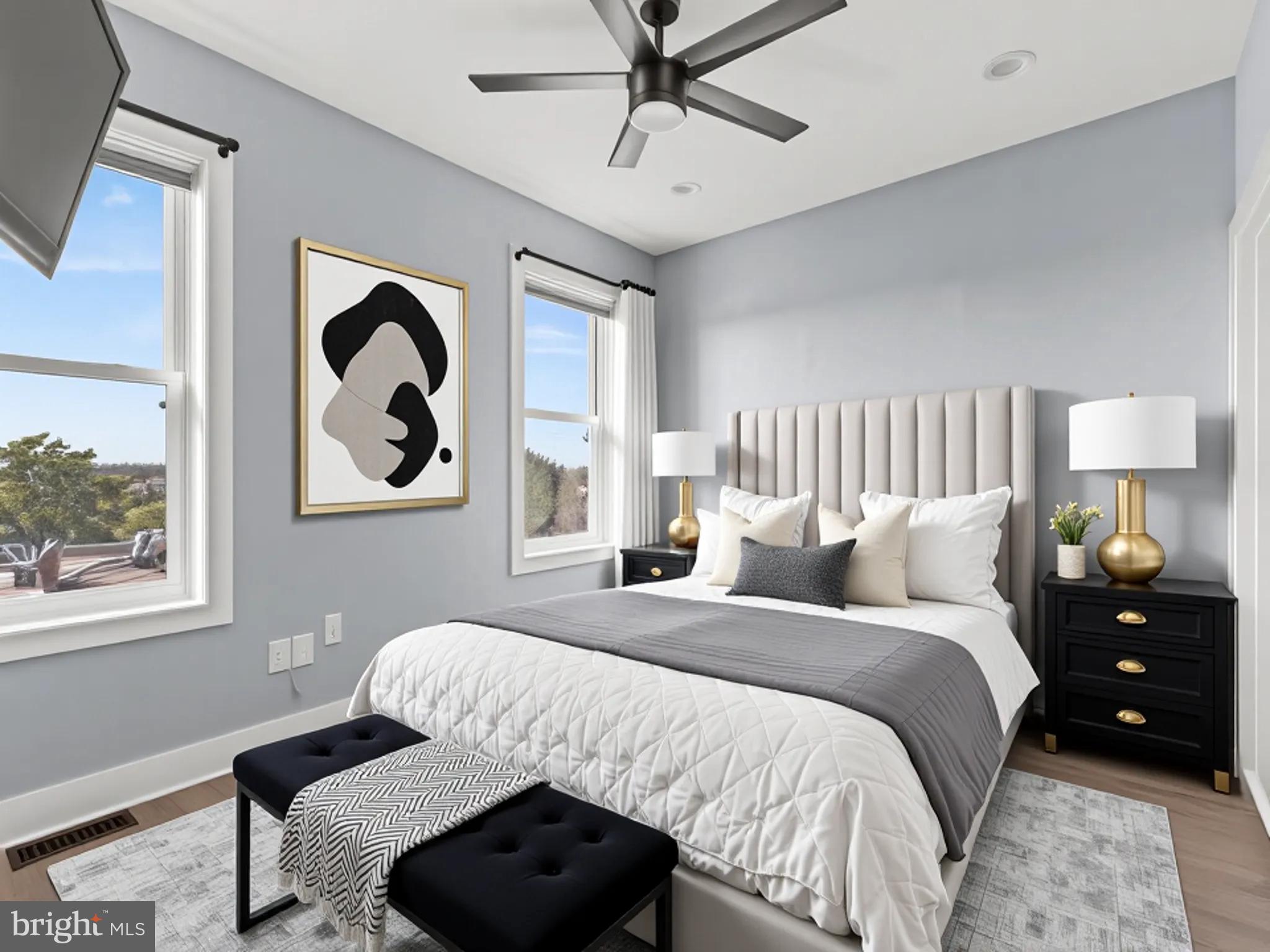 1267 Penn Street Northeast, Unit B Washington, DC 20002 - Photo 2 of 20 a bedroom with a bed and a painting on the wall