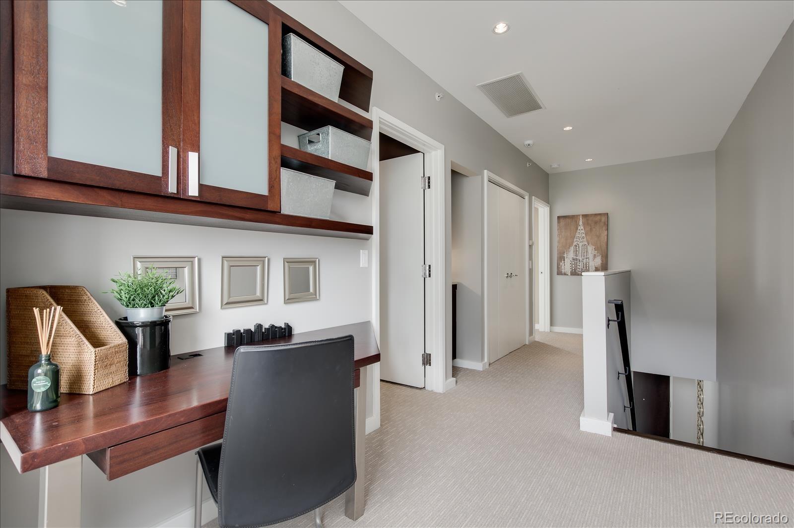 1640 Little Raven Street Denver, CO 80202 - Photo 19 of 37 a dining room with furniture and a kitchen