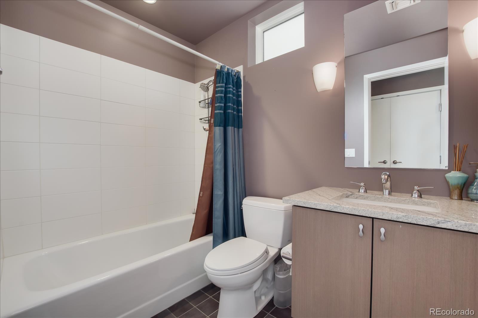 1640 Little Raven Street Denver, CO 80202 - Photo 25 of 37 a bathroom with a sink toilet and shower