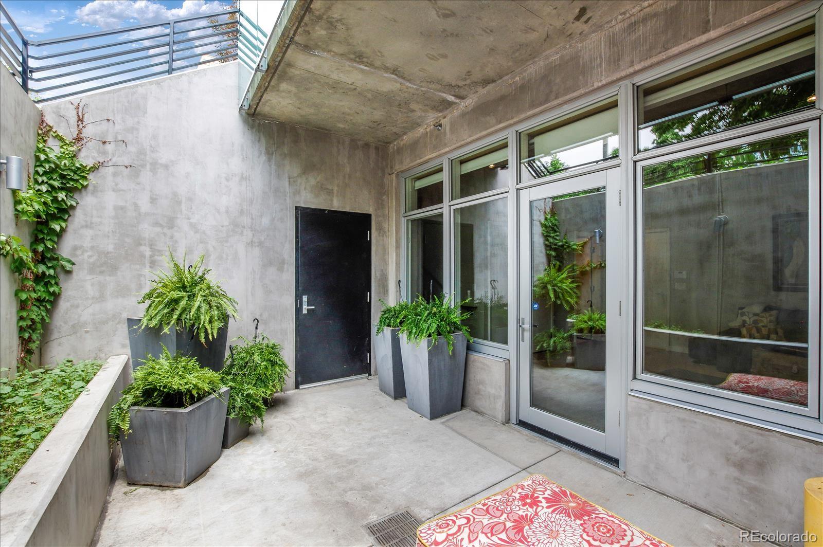 1640 Little Raven Street Denver, CO 80202 - Photo 28 of 37 a front view of a house with garden