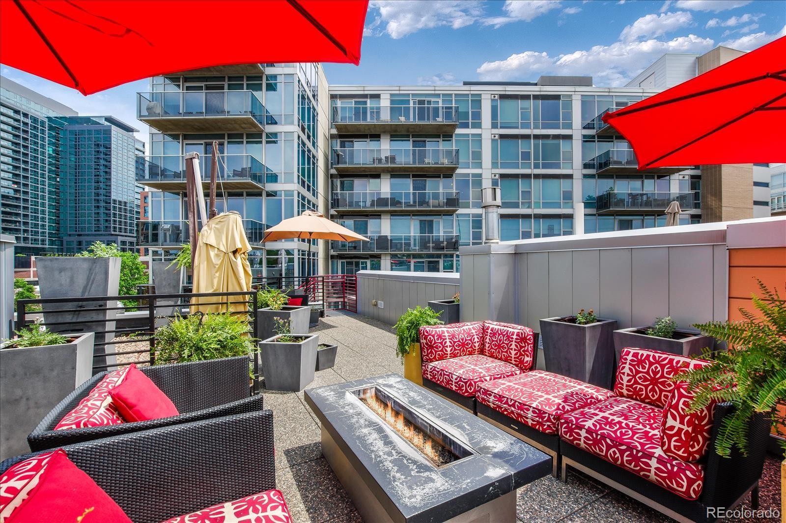 1640 Little Raven Street Denver, CO 80202 - Photo 31 of 37 a group of chairs sitting in front of a building