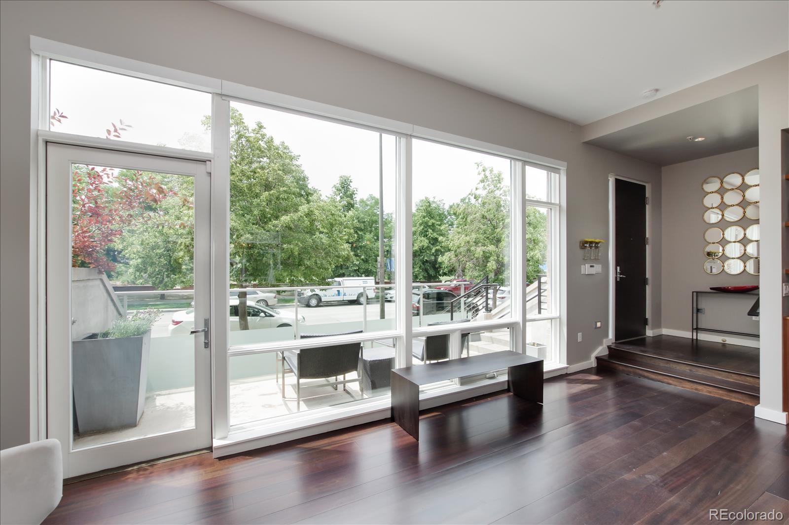 1640 Little Raven Street Denver, CO 80202 - Photo 4 of 37 a view of a living room and hardwood floor