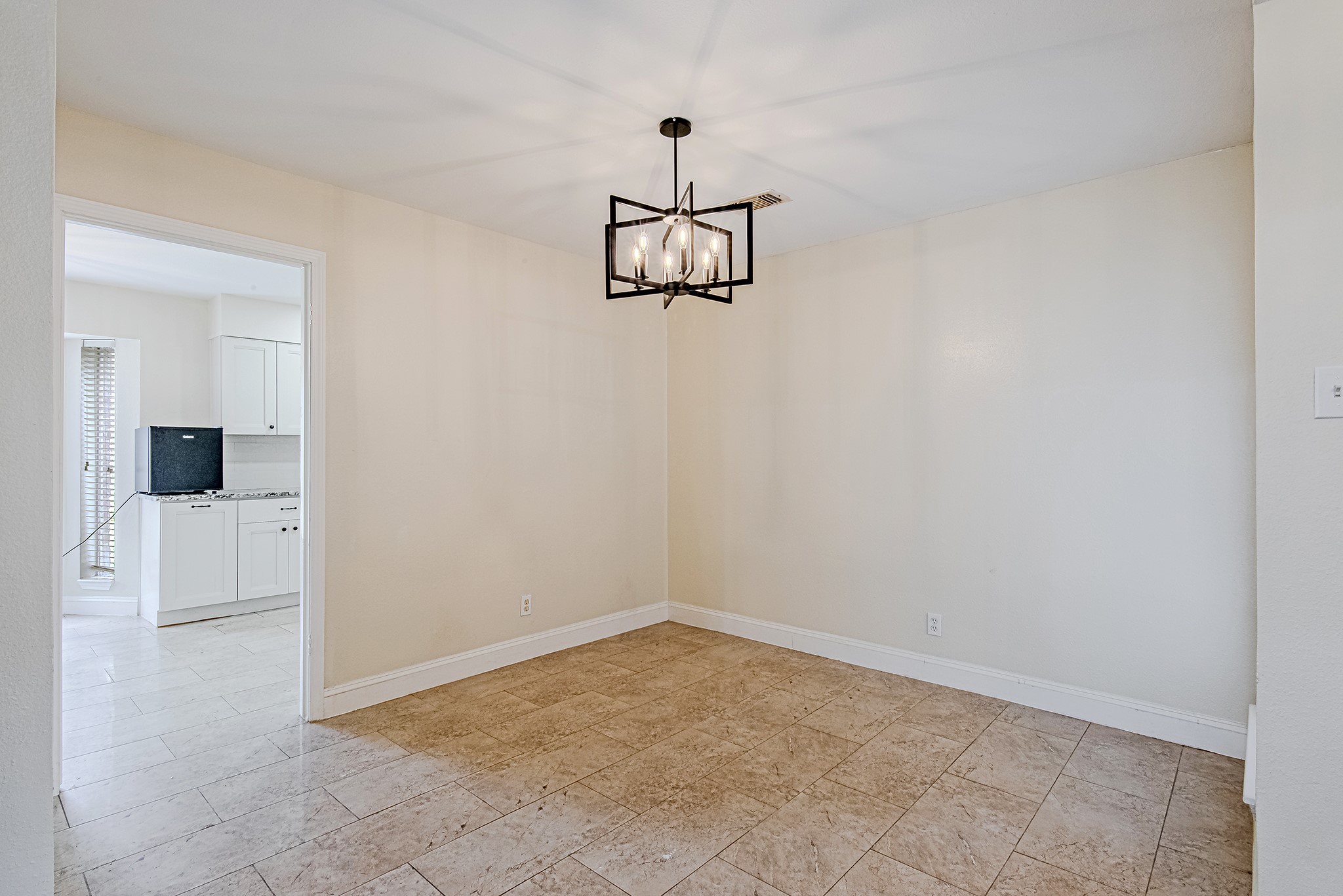 17811 Hawk Haven Lane Spring, TX 77379 - Photo 11 of 22 Dedicated dining area with modern light fixture and neutral finishes.