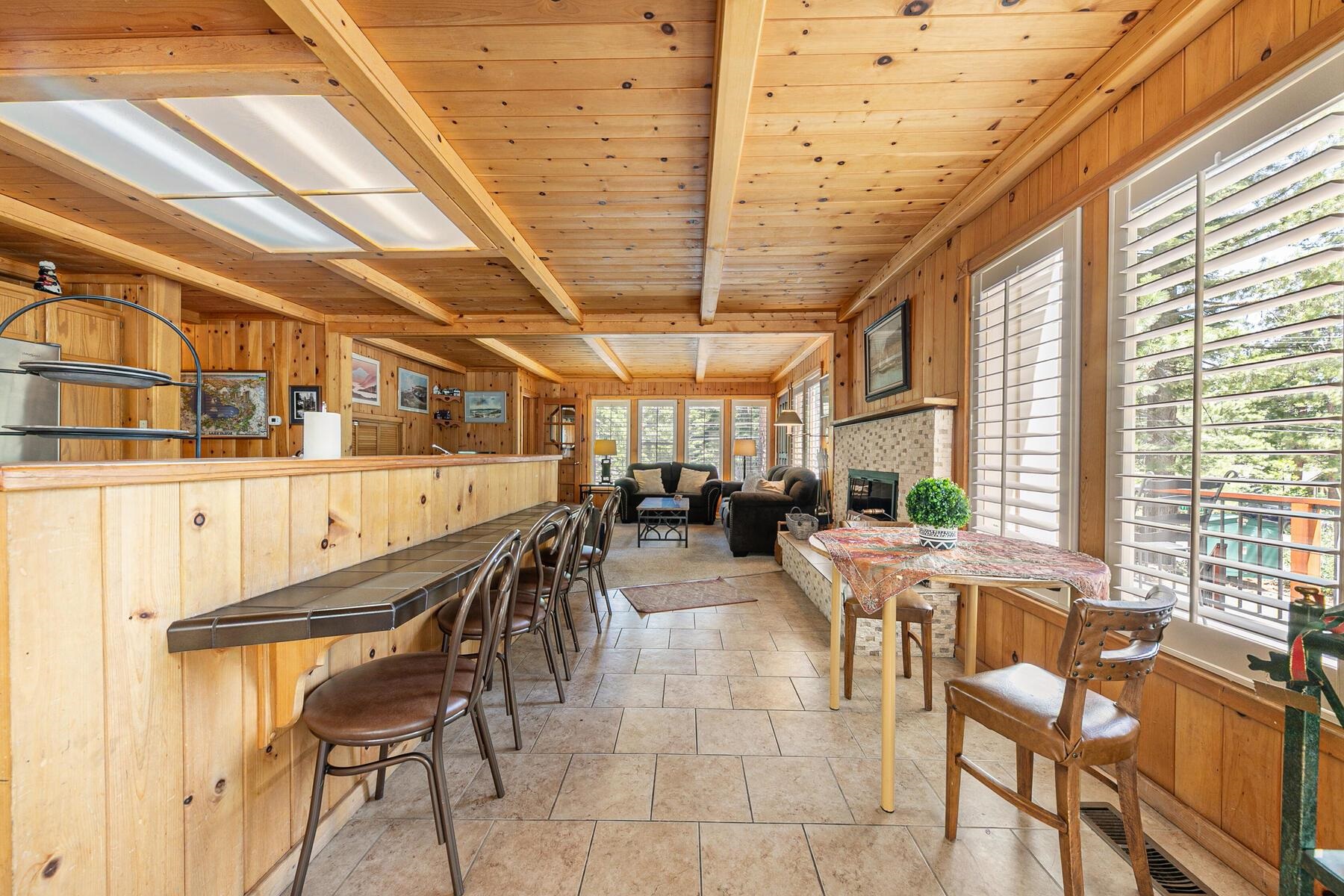 5775 Victoria Drive Carnelian Bay, CA 96140 - Photo 11 of 28 a view of a dining room with furniture window and outside view