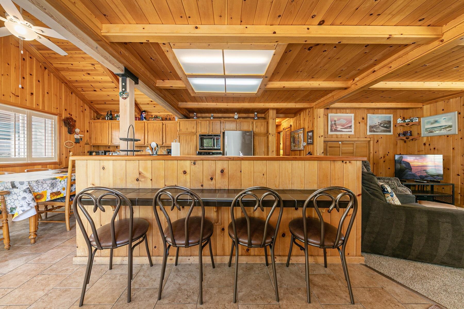 5775 Victoria Drive Carnelian Bay, CA 96140 - Photo 12 of 28 a dining hall with stainless steel appliances granite countertop a table and chairs