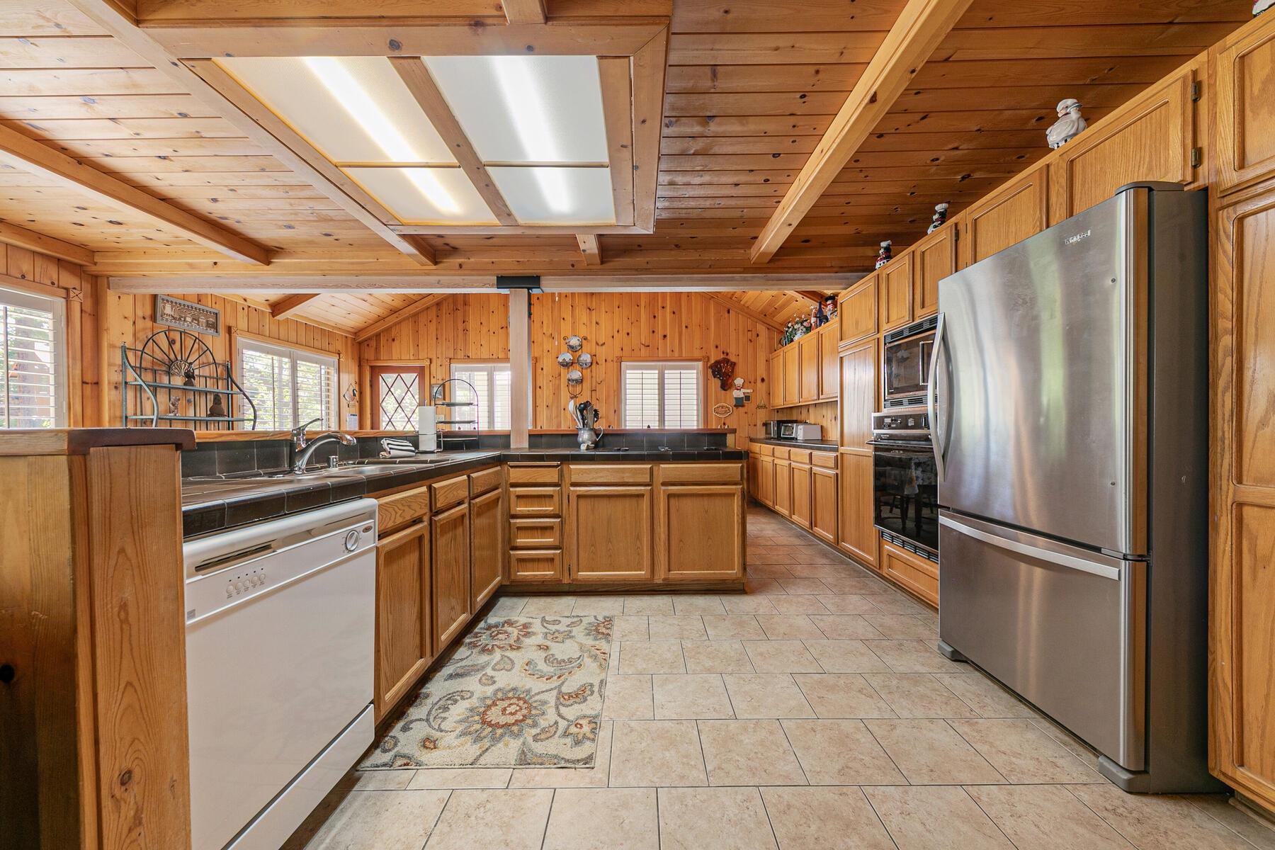 5775 Victoria Drive Carnelian Bay, CA 96140 - Photo 14 of 28 a large kitchen with a stove a refrigerator and a sink