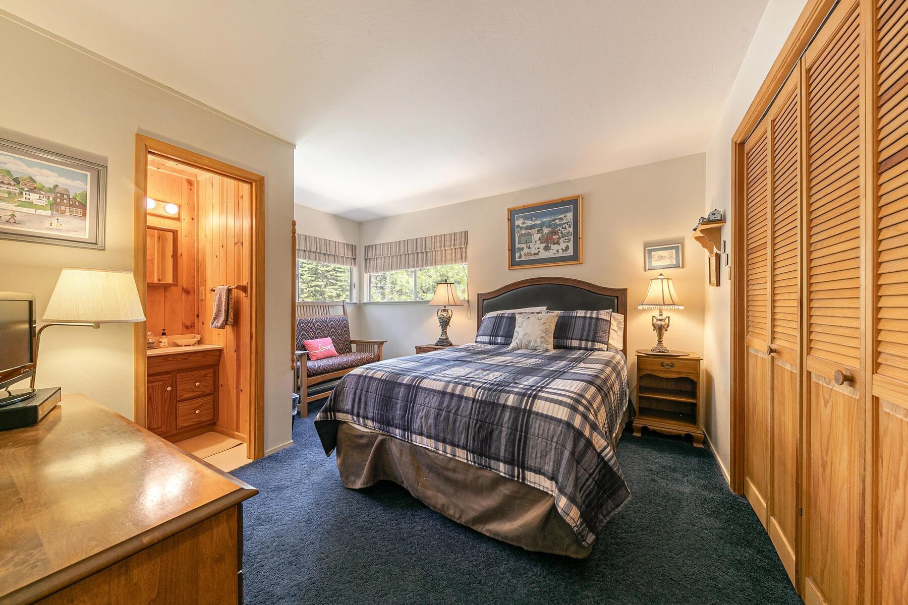 5775 Victoria Drive Carnelian Bay, CA 96140 - Photo 17 of 28 a bedroom with a bed and wooden floor