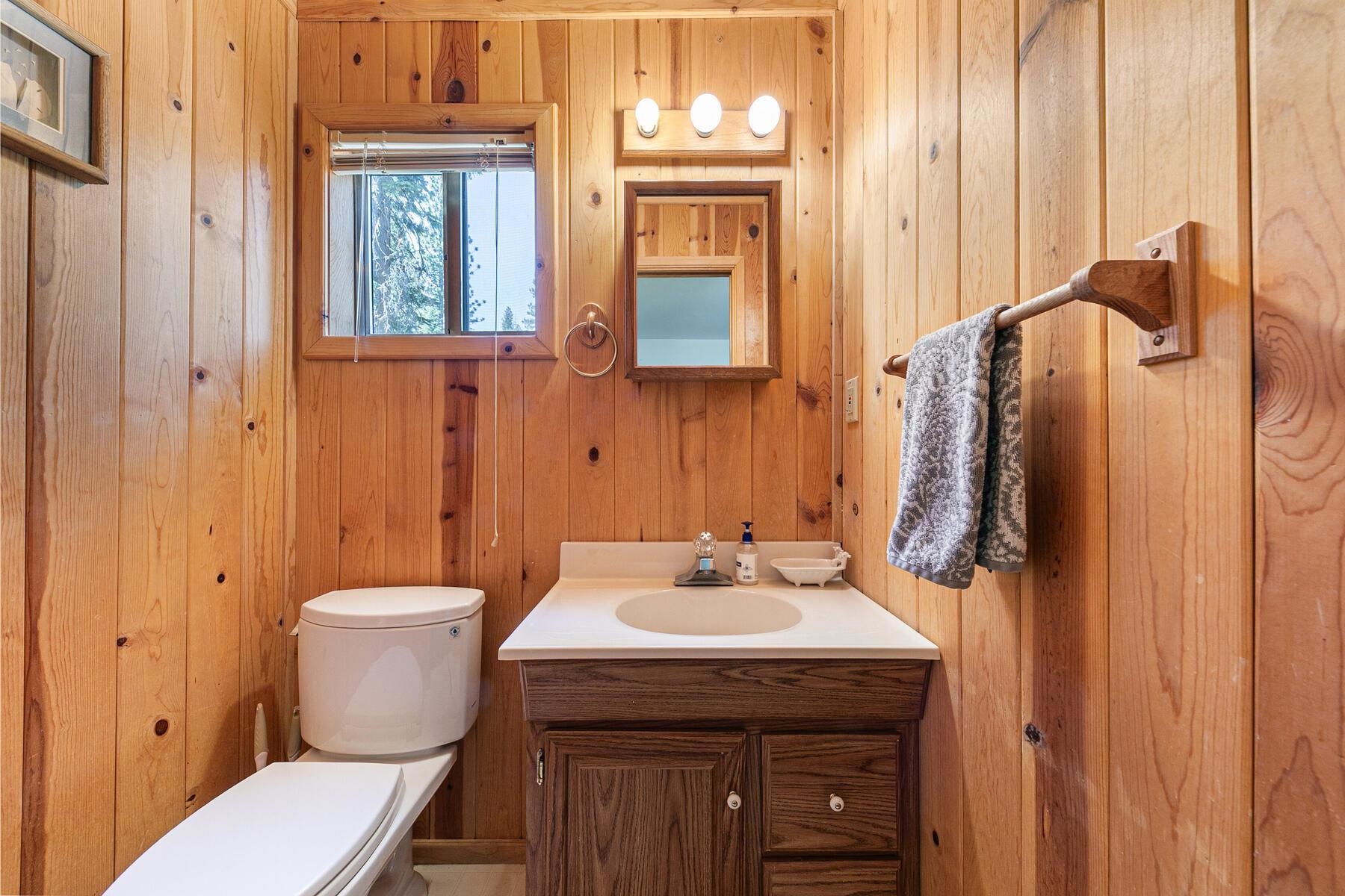 5775 Victoria Drive Carnelian Bay, CA 96140 - Photo 18 of 28 a bathroom with a sink toilet and shower