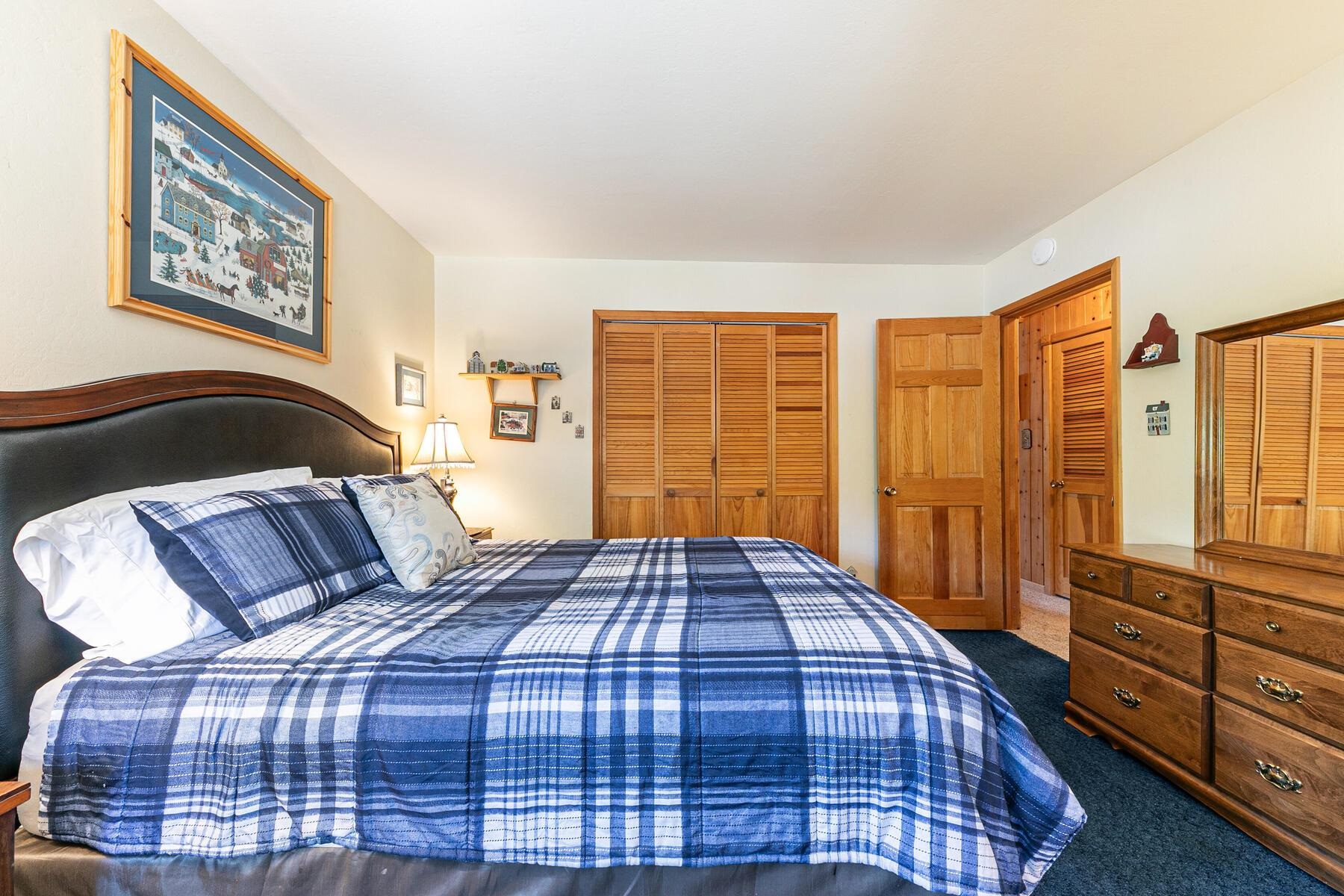 5775 Victoria Drive Carnelian Bay, CA 96140 - Photo 19 of 28 a bedroom with a bed and wooden floor