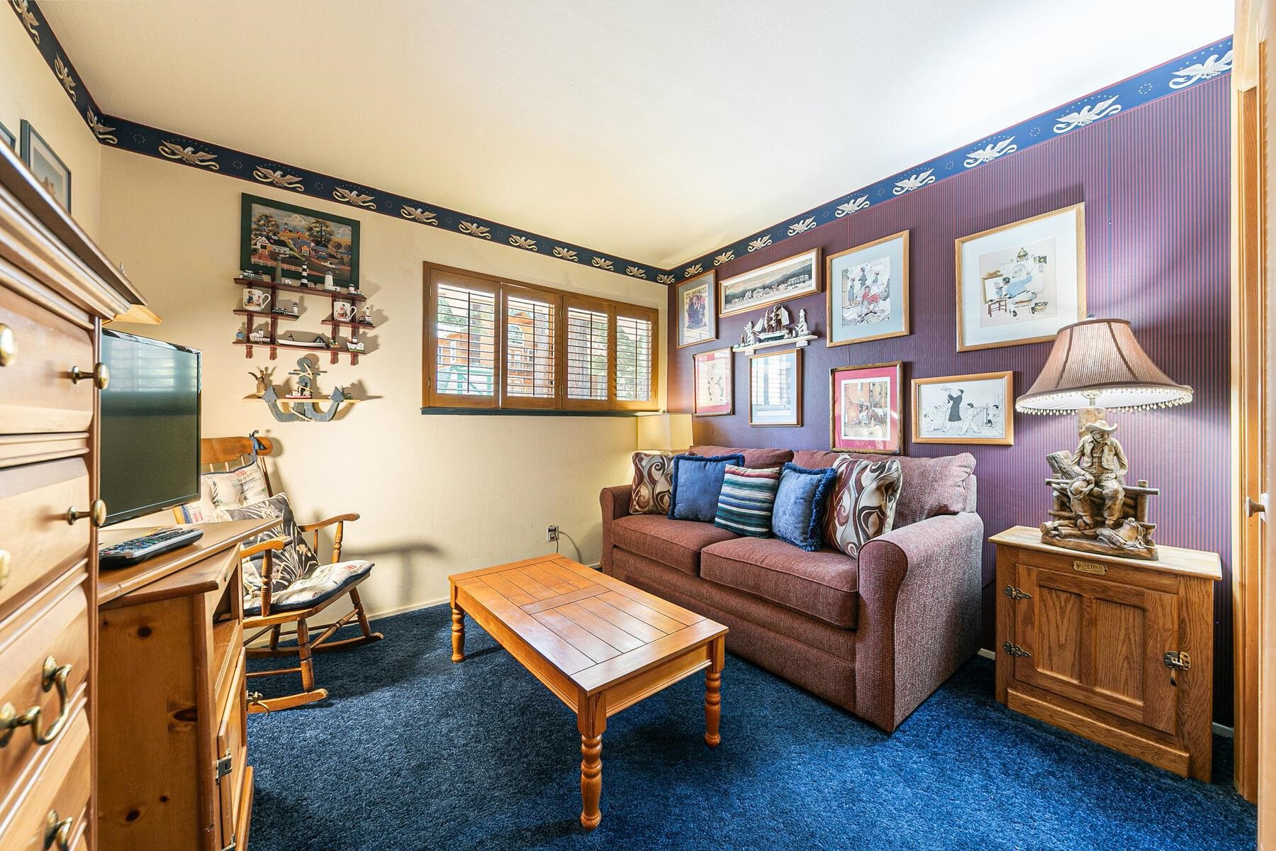 5775 Victoria Drive Carnelian Bay, CA 96140 - Photo 20 of 28 a living room with furniture a flat screen tv and a window