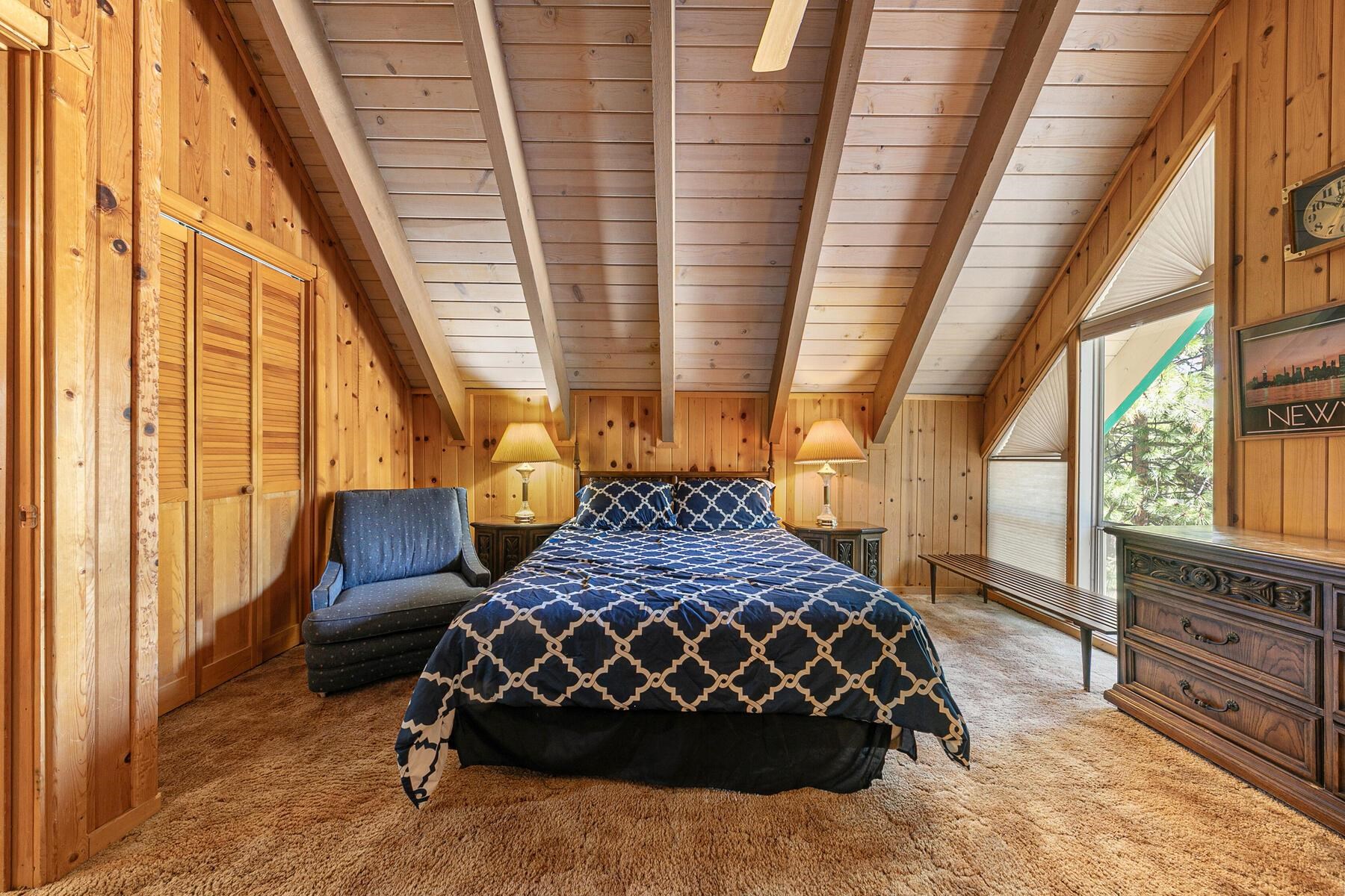 5775 Victoria Drive Carnelian Bay, CA 96140 - Photo 22 of 28 a large room with a bed and a window