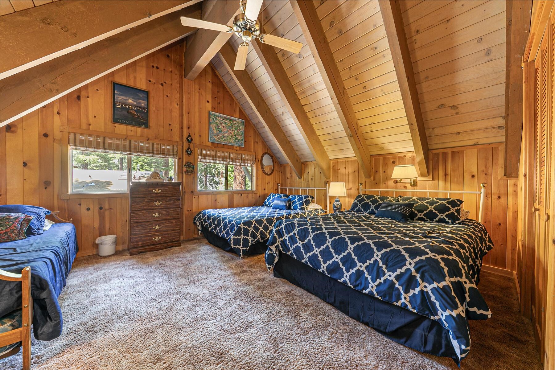 5775 Victoria Drive Carnelian Bay, CA 96140 - Photo 25 of 28 a bed sitting in a bedroom next to a window