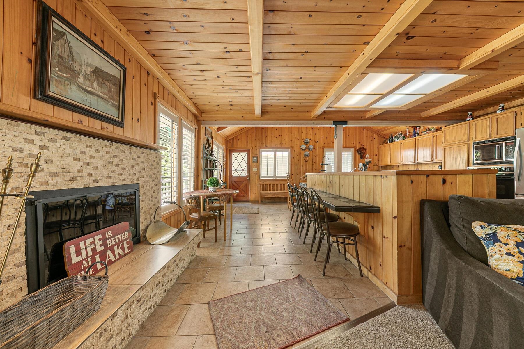 5775 Victoria Drive Carnelian Bay, CA 96140 - Photo 6 of 28 a living room with furniture and a fireplace