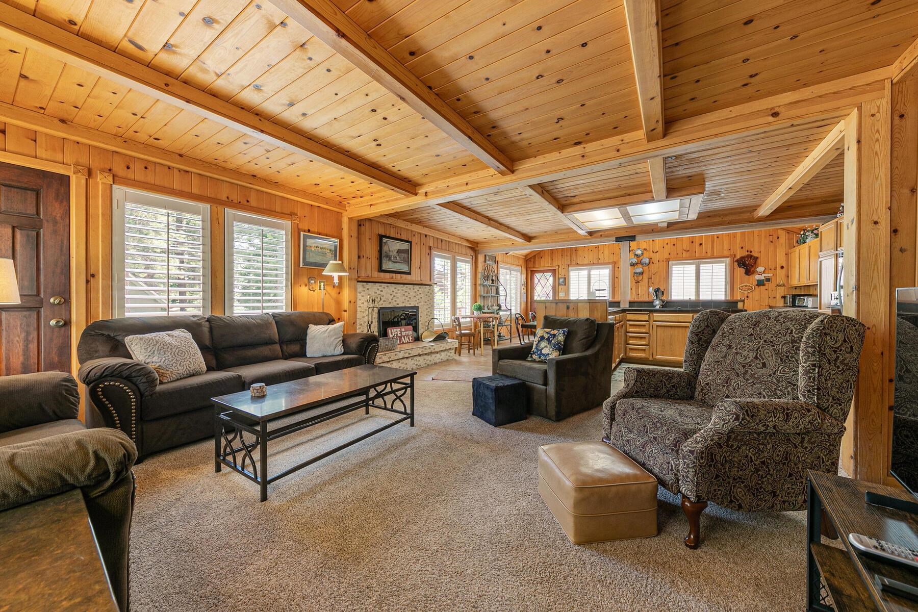 5775 Victoria Drive Carnelian Bay, CA 96140 - Photo 7 of 28 a living room with furniture and a large window