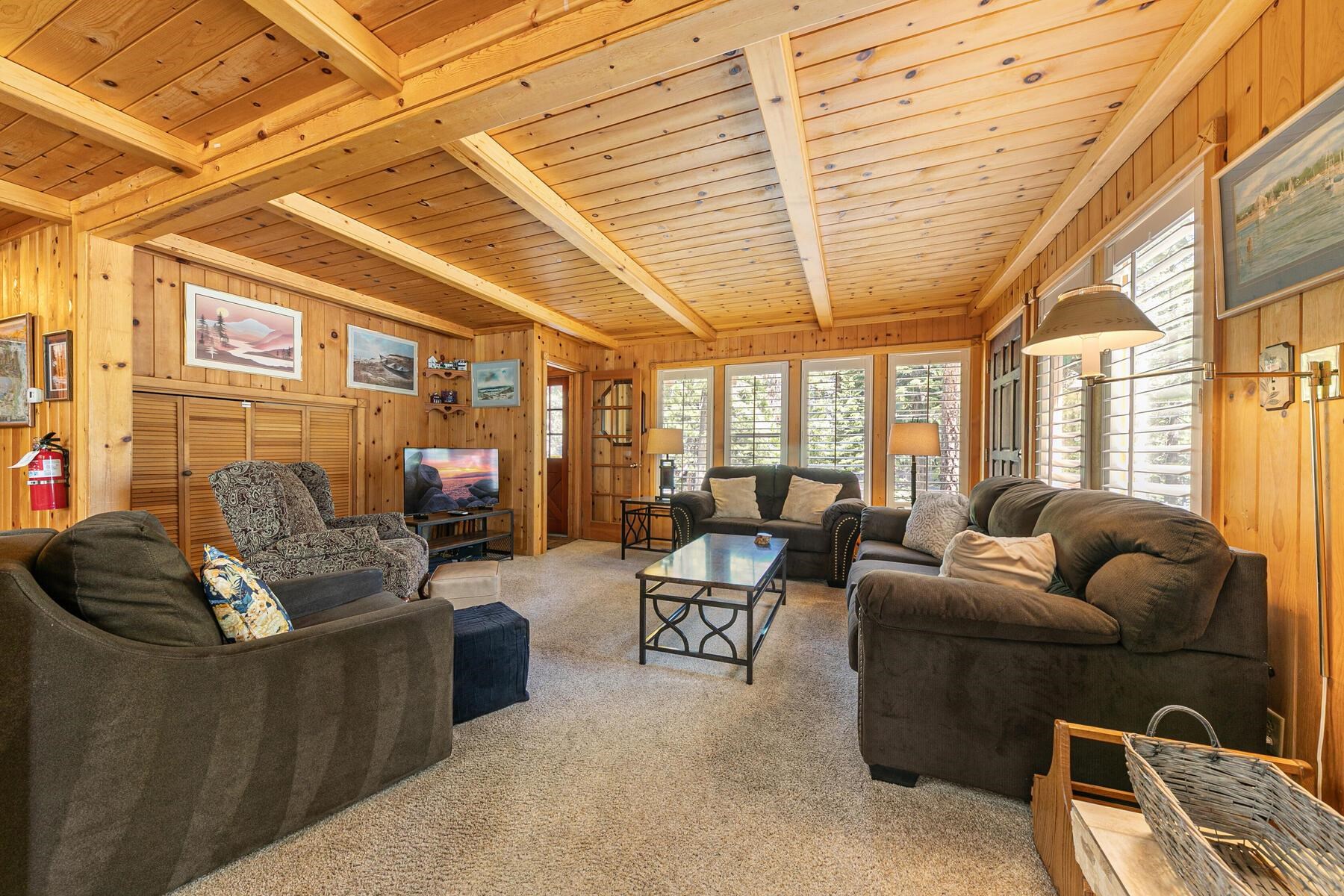 5775 Victoria Drive Carnelian Bay, CA 96140 - Photo 8 of 28 a living room with furniture and a large window