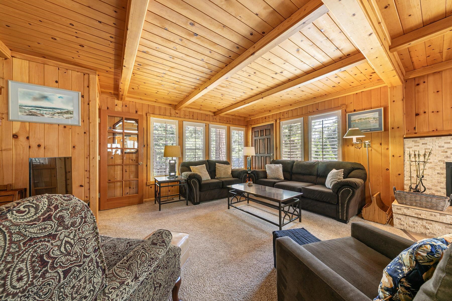 5775 Victoria Drive Carnelian Bay, CA 96140 - Photo 9 of 28 a living room with furniture and a large window