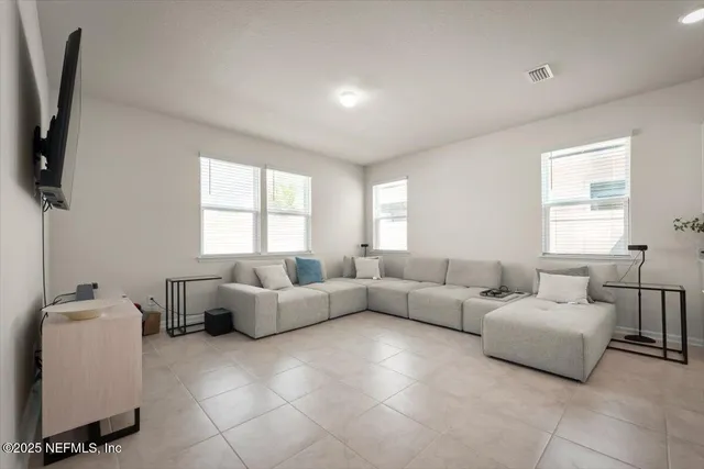 a hallway with a table and a window