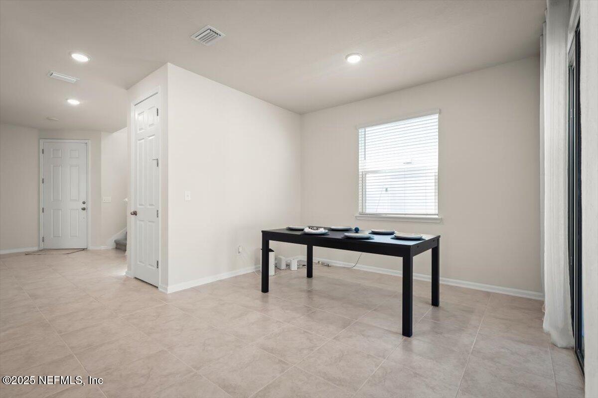 7194 Red Timber Road Jacksonville, FL 32244 - Photo 18 of 40 a hallway with a table and a window