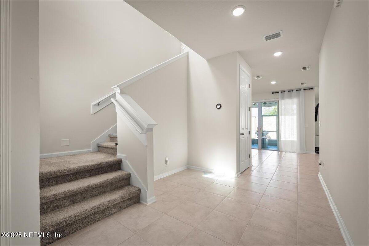 7194 Red Timber Road Jacksonville, FL 32244 - Photo 2 of 40 a view of entryway and hall with wooden floor