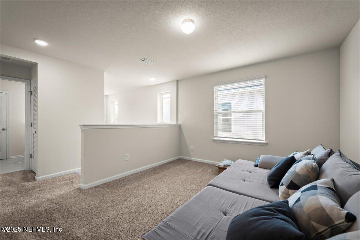 7194 Red Timber Road Jacksonville, FL 32244 - Photo 22 of 40 a bed room with a bed and a window