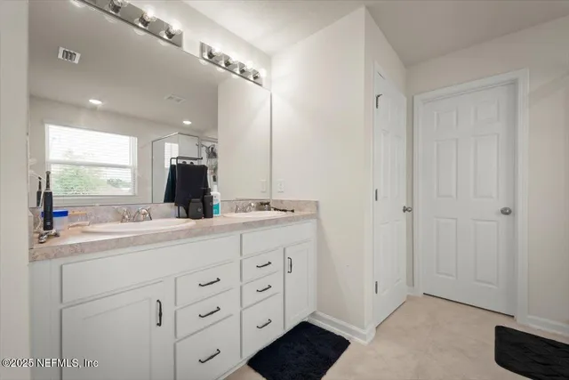 a view of hallway with walk in closet