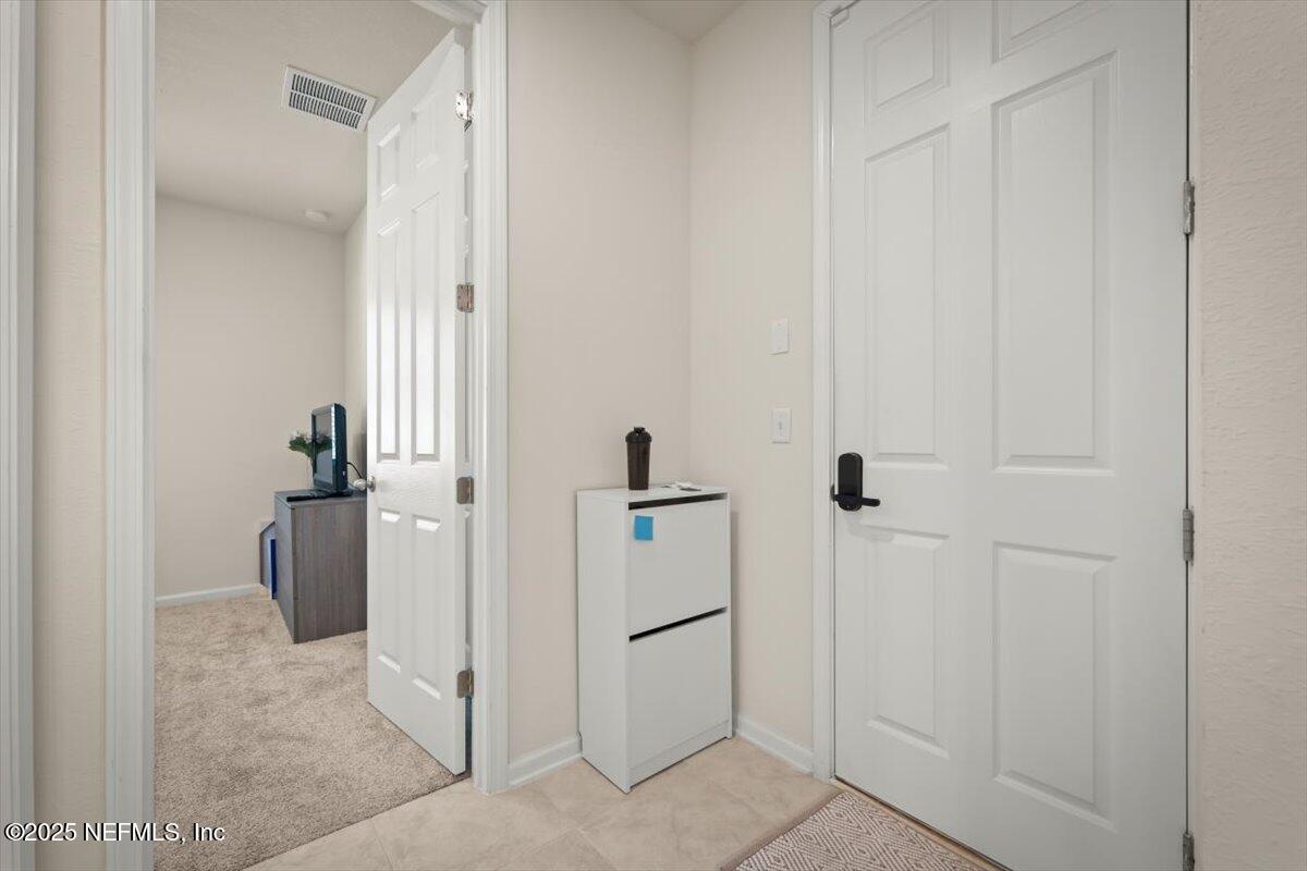 7194 Red Timber Road Jacksonville, FL 32244 - Photo 37 of 40 a view of hallway with walk in closet