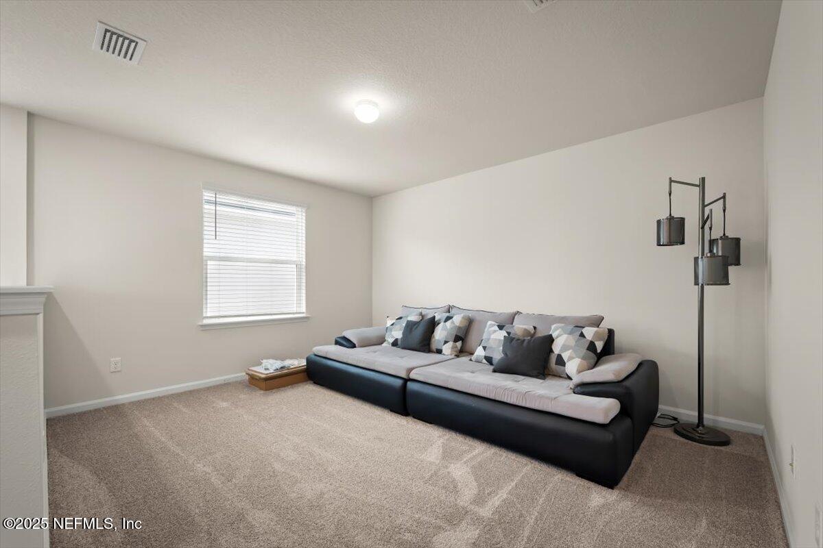 7194 Red Timber Road Jacksonville, FL 32244 - Photo 7 of 40 a living room with furniture and a window