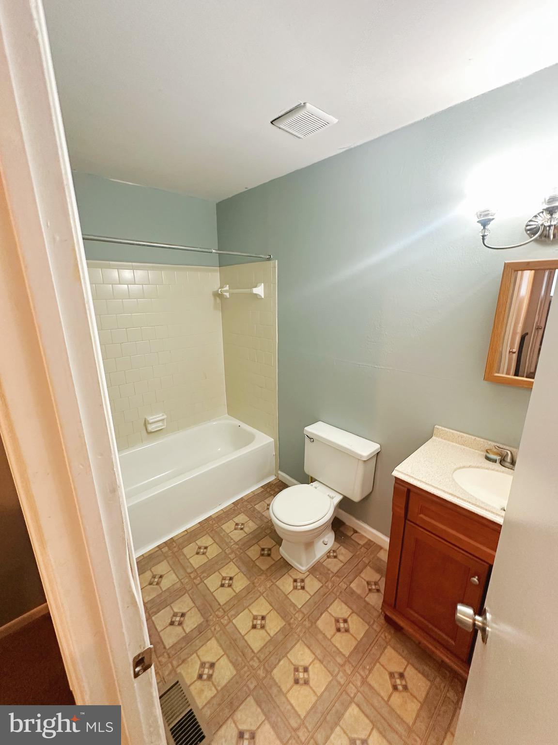 807 C Windstream Way, Unit 807C Edgewood, MD 21040 - Photo 11 of 11 a bathroom with a sink a toilet a tub and shower