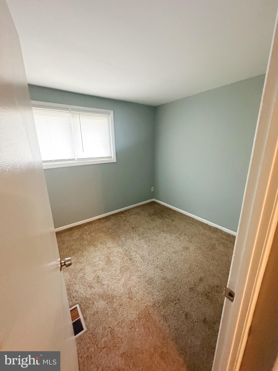 807 C Windstream Way, Unit 807C Edgewood, MD 21040 - Photo 8 of 11 an empty room with a window